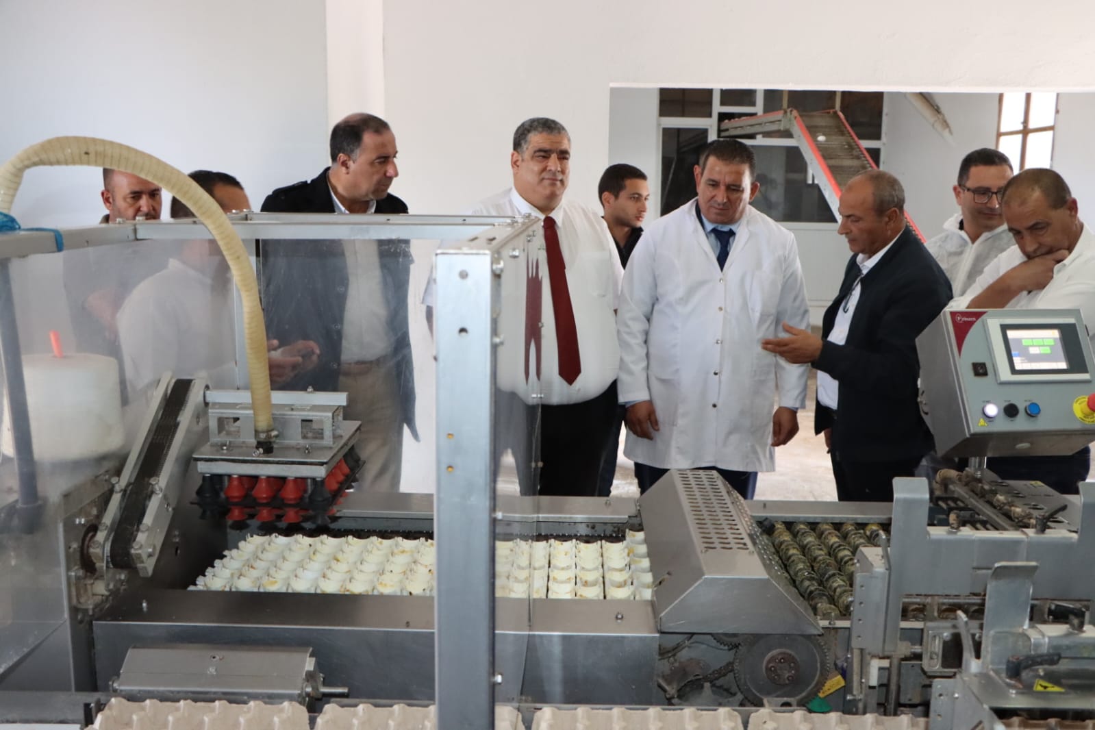Egg processing machine at Commune Amiret Hojjej for local food production and economic development.